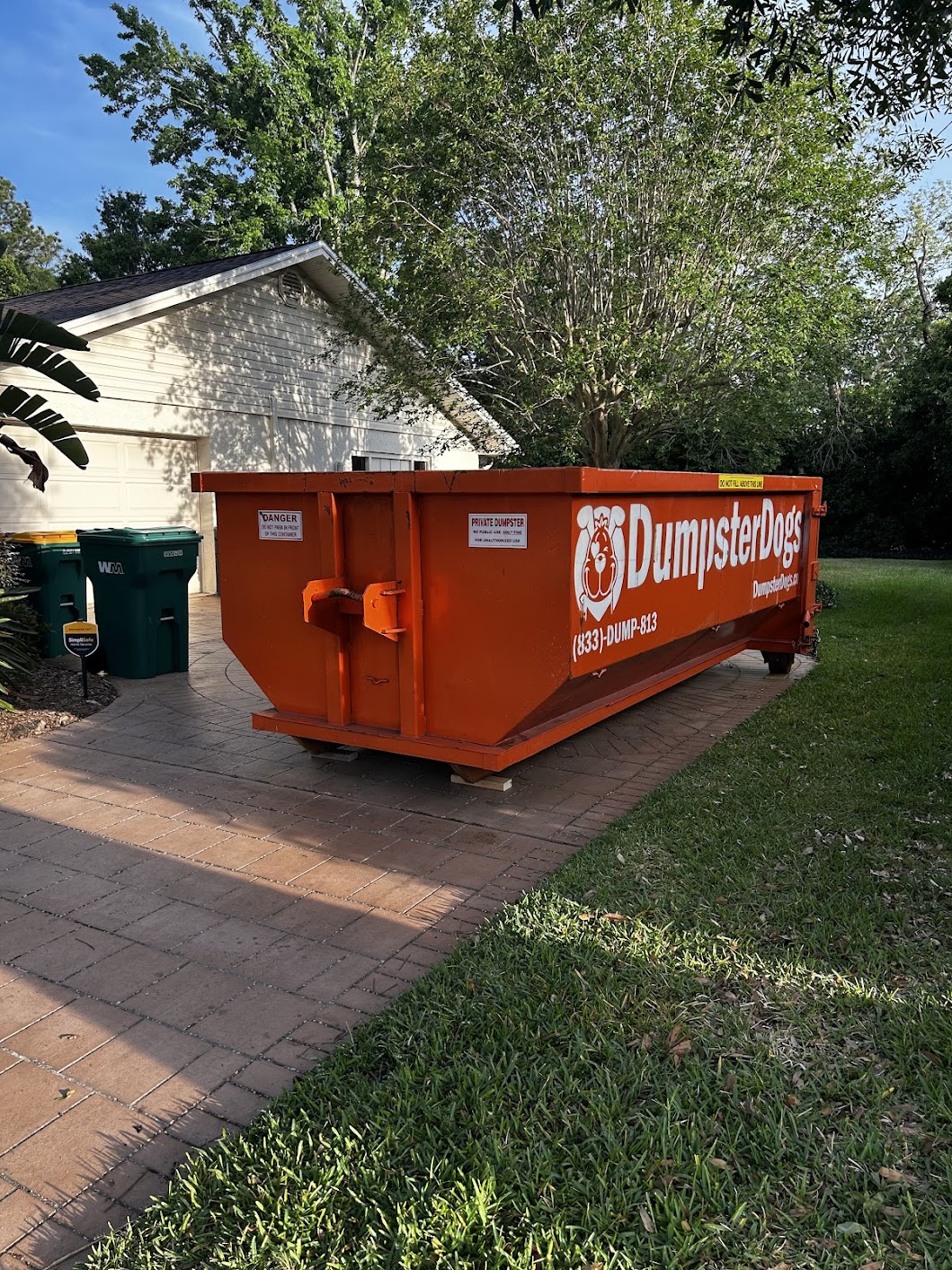 Loaded dumpster showing space-saving loading hacks, Tampa Bay